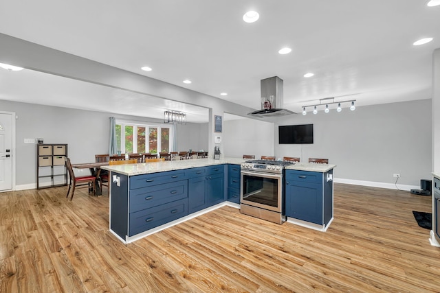 1810 Jana Ln, Morris, IL 60450 - kitchen with gas stove, island range hood, blue cabinets, light wood-style flooring, and recessed lighting