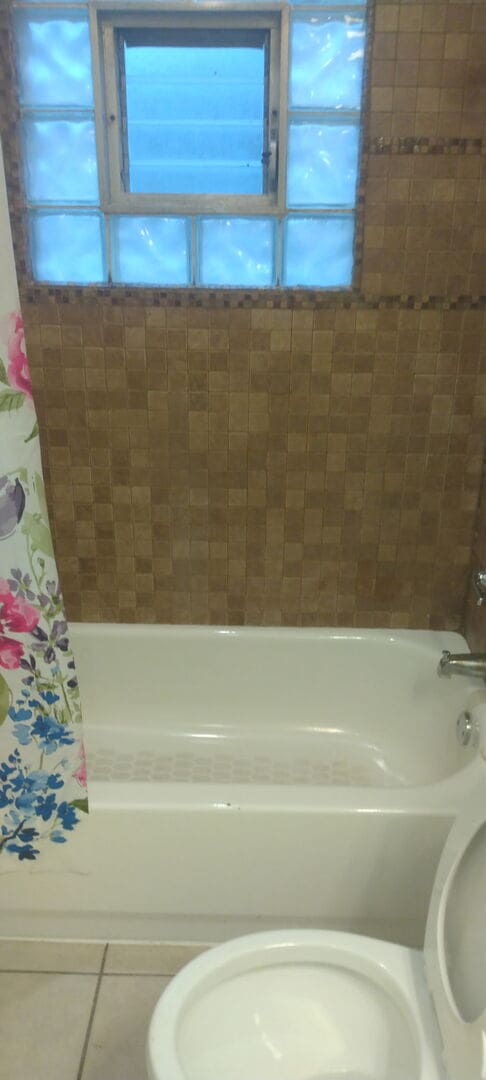 509 Barbara Ct S, University Park, IL 60484 - bathroom with tile patterned floors and shower / tub combo with curtain