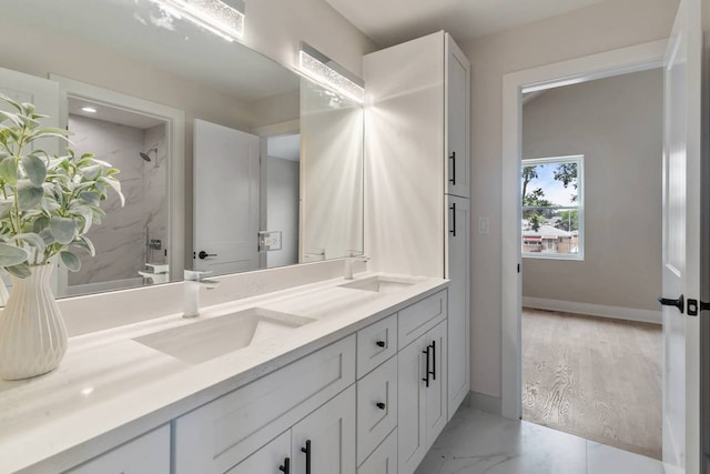 7431 W Forest Preserve Ave, Chicago, IL 60634 - full bathroom with double vanity, a shower, and marble finish flooring