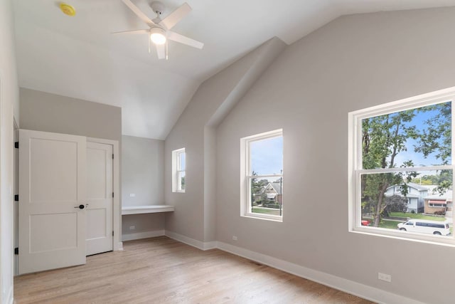 7431 W Forest Preserve Ave, Chicago, IL 60634 - unfurnished bedroom featuring vaulted ceiling and light wood-style floors