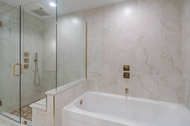 7431 W Forest Preserve Ave, Chicago, IL 60634 - full bath with a garden tub, a marble finish shower, and tile walls