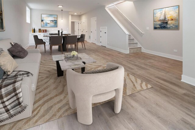 7431 W Forest Preserve Ave, Chicago, IL 60634 - living area with light wood finished floors, stairs, and recessed lighting