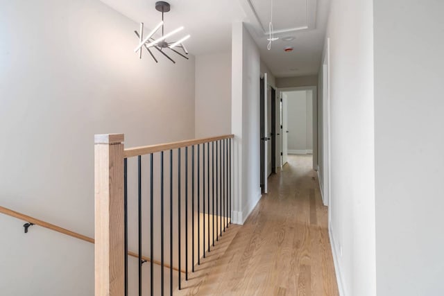 7431 W Forest Preserve Ave, Chicago, IL 60634 - hall with attic access, wood finished floors, and an upstairs landing
