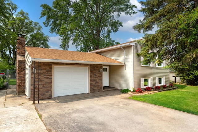 337 E Briarcliff Rd, Bolingbrook, IL 60440 - tri-level home featuring an attached garage, a chimney, concrete driveway, and a shingled roof