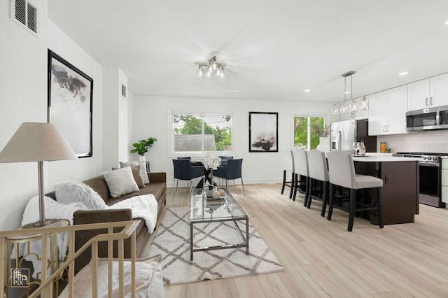 337 E Briarcliff Rd, Bolingbrook, IL 60440 - living room with light wood-style flooring and recessed lighting