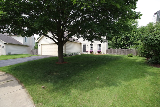 2799 Squaw Valley Trl, Aurora, IL 60503 - view of property hidden behind natural elements with a garage and asphalt driveway