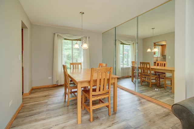 2799 Squaw Valley Trl, Aurora, IL 60503 - dining room with a chandelier and light wood-type flooring