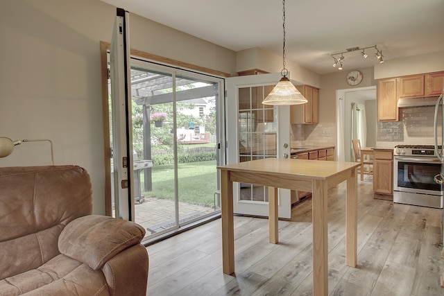 2799 Squaw Valley Trl, Aurora, IL 60503 - kitchen featuring stainless steel gas stove, light brown cabinets, backsplash, open floor plan, and light countertops