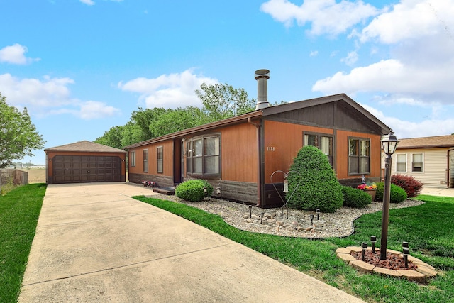1178 Barry Ln, Sauk Village, IL 60411 - view of front of home featuring a detached garage and a front lawn