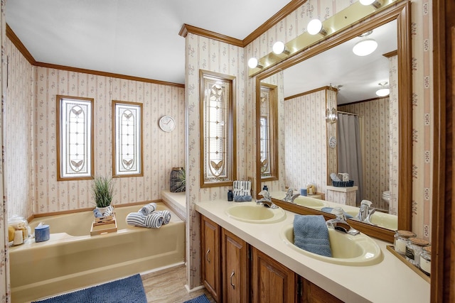1178 Barry Ln, Sauk Village, IL 60411 - bathroom featuring wallpapered walls, ornamental molding, a garden tub, double vanity, and wood finished floors