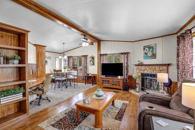 1178 Barry Ln, Sauk Village, IL 60411 - living room with wood finished floors, a ceiling fan, wood walls, and a stone fireplace