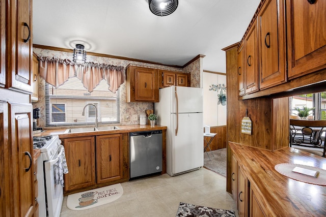 1178 Barry Ln, Sauk Village, IL 60411 - kitchen featuring white appliances, butcher block counters, brown cabinetry, ornamental molding, and wood walls