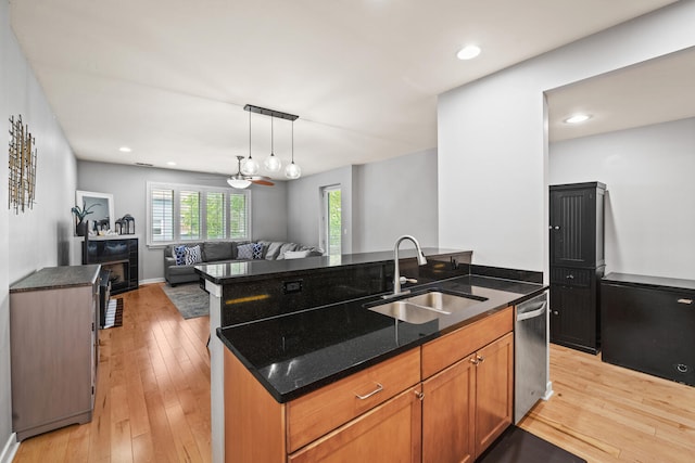 3021 W Armitage Ave Unit 201, Chicago, IL 60647 - kitchen with an island with sink, dishwasher, open floor plan, light wood-style flooring, and recessed lighting