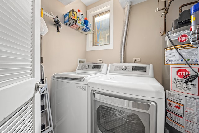 3021 W Armitage Ave Unit 201, Chicago, IL 60647 - laundry room with washing machine and dryer and gas water heater