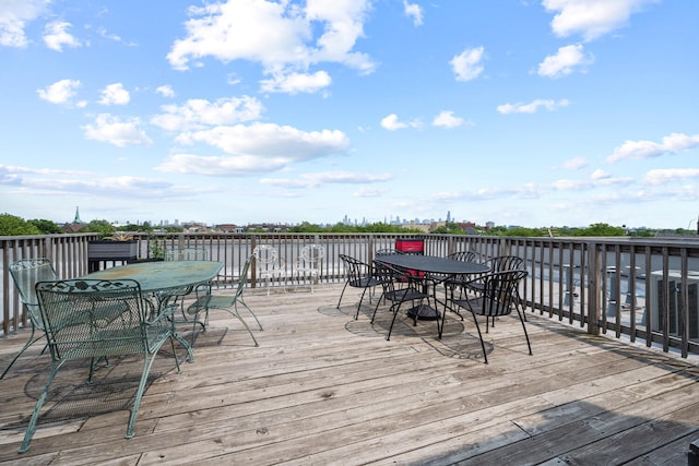 3021 W Armitage Ave Unit 201, Chicago, IL 60647 - wooden terrace with outdoor dining space