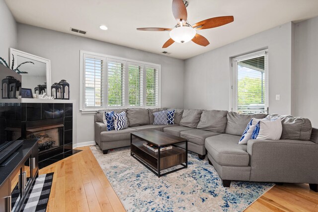 3021 W Armitage Ave Unit 201, Chicago, IL 60647 - living area featuring a ceiling fan, wood finished floors, a fireplace, and recessed lighting