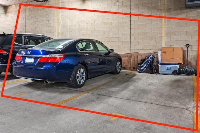 3021 W Armitage Ave Unit 201, Chicago, IL 60647 - parking garage featuring concrete block wall
