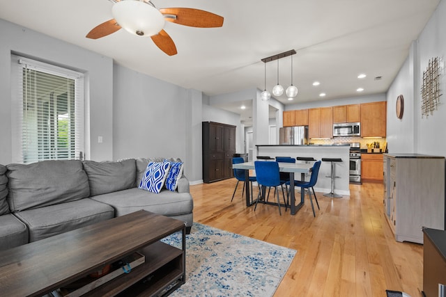 3021 W Armitage Ave Unit 201, Chicago, IL 60647 - living area featuring a ceiling fan, light wood-style floors, and recessed lighting