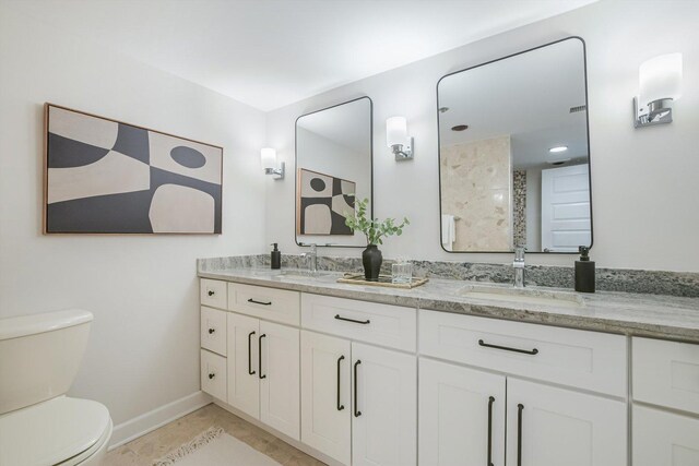 161 E Chicago Ave Unit 49B, Chicago, IL 60611 - bathroom with double vanity, a shower, and tile patterned floors