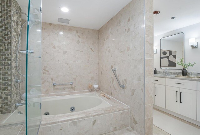 161 E Chicago Ave Unit 49B, Chicago, IL 60611 - bathroom with a jetted tub, vanity, and a tile shower