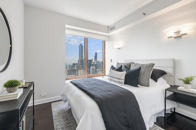 161 E Chicago Ave Unit 49B, Chicago, IL 60611 - bedroom with dark wood finished floors and a skyline view