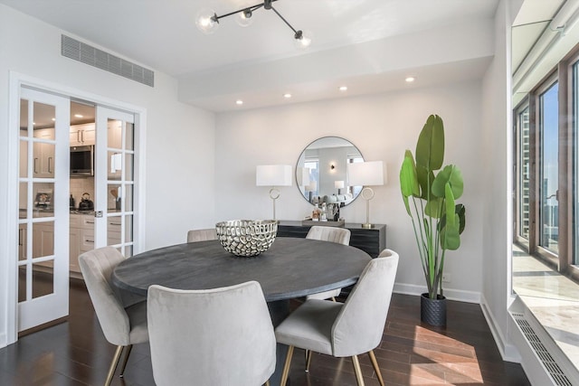 161 E Chicago Ave Unit 49B, Chicago, IL 60611 - dining space featuring dark wood-style flooring, recessed lighting, and french doors