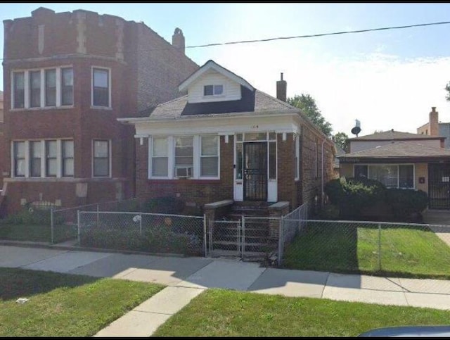 1519 E 76th Pl, Chicago, IL 60619 - view of front facade featuring a fenced front yard, brick siding, a gate, and a chimney