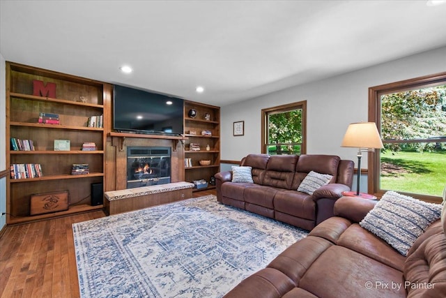 42W412 Sylvan Ln, Saint Charles, IL 60175 - living room with dark wood-style floors, a glass covered fireplace, and recessed lighting