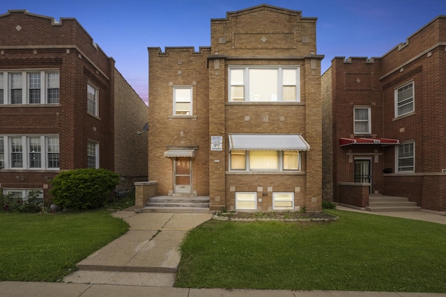 6024 W Addison St, Chicago, IL 60634 - view of front of house featuring brick siding and a front lawn