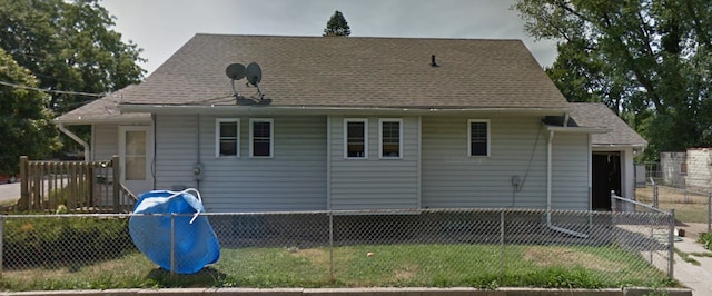 1319 Fairview Ave, Rockford, IL 61101 - rear view of house with roof with shingles and an attached garage