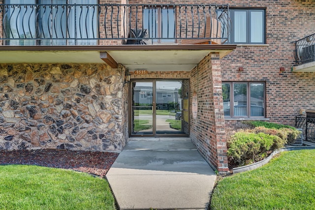 9535 S Mayfield Ave Unit 203, Oak Lawn, IL 60453 - doorway to property featuring a balcony, brick siding, and stone siding