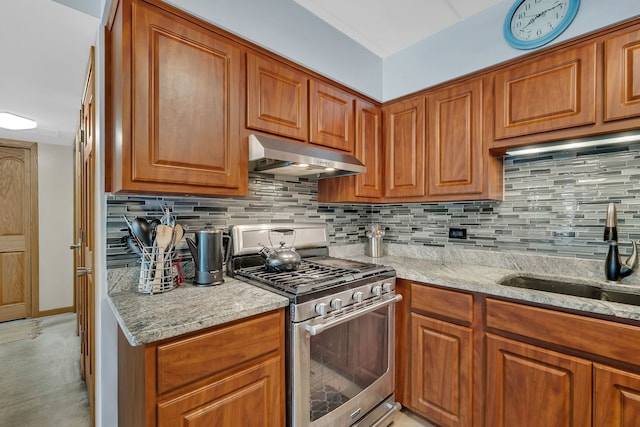 9535 S Mayfield Ave Unit 203, Oak Lawn, IL 60453 - kitchen featuring stainless steel gas range, under cabinet range hood, light stone countertops, and brown cabinets