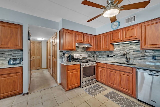9535 S Mayfield Ave Unit 203, Oak Lawn, IL 60453 - kitchen featuring appliances with stainless steel finishes, under cabinet range hood, tasteful backsplash, ceiling fan, and brown cabinetry