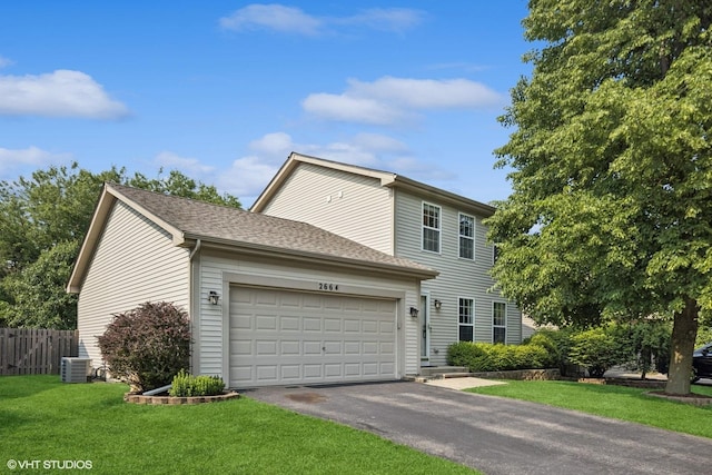 2664 Stuart Kaplan Dr, Aurora, IL 60503 - view of front of home with driveway, an attached garage, and a shingled roof