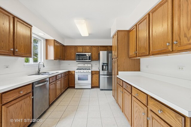 2664 Stuart Kaplan Dr, Aurora, IL 60503 - kitchen with dishwasher, brown cabinets, and light countertops