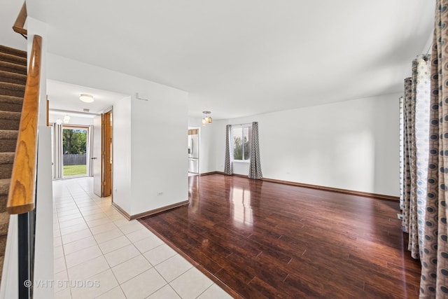 2664 Stuart Kaplan Dr, Aurora, IL 60503 - empty room featuring stairs and hardwood / wood-style floors