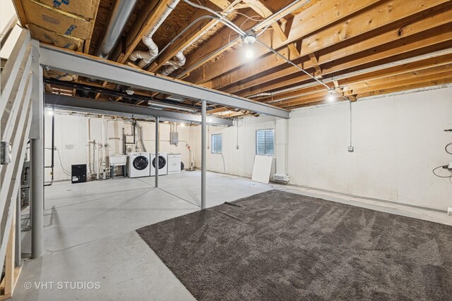 2664 Stuart Kaplan Dr, Aurora, IL 60503 - unfinished below grade area featuring washer and dryer, water heater, stairway, electric panel, and drainage system