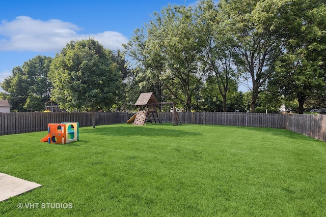 2664 Stuart Kaplan Dr, Aurora, IL 60503 - fenced backyard featuring a playground