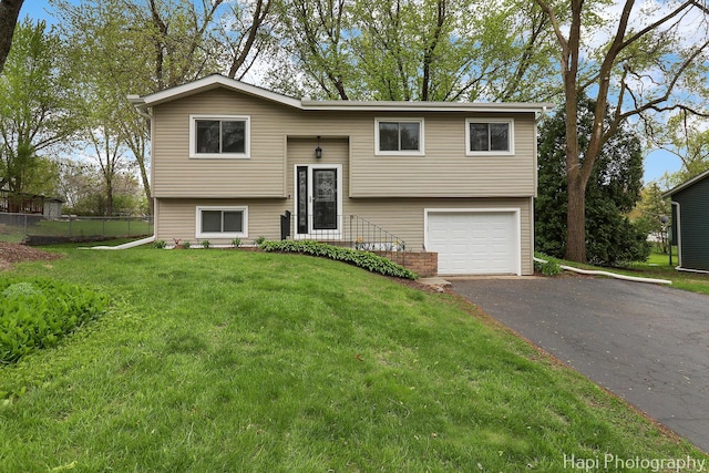 1113 Rolling Lane Rd, Johnsburg, IL 60051 - bi-level home with an attached garage and asphalt driveway