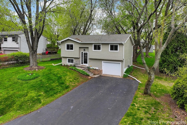 1113 Rolling Lane Rd, Johnsburg, IL 60051 - raised ranch featuring driveway, an attached garage, and a front yard