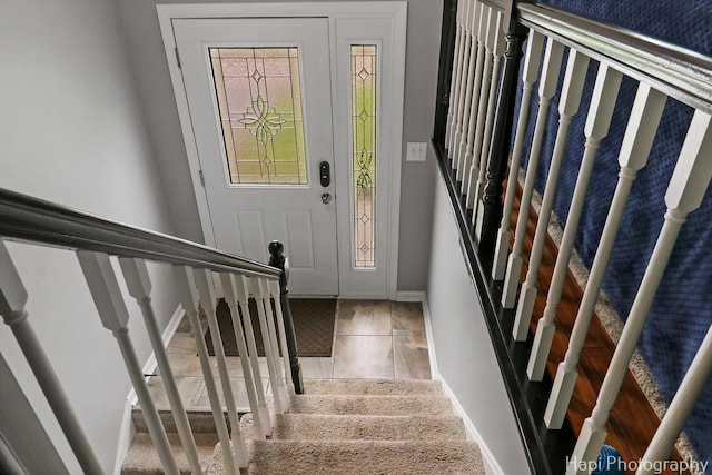 1113 Rolling Lane Rd, Johnsburg, IL 60051 - foyer with stairway and baseboards