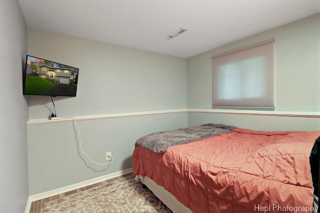 1113 Rolling Lane Rd, Johnsburg, IL 60051 - bedroom featuring wood finished floors and a wainscoted wall