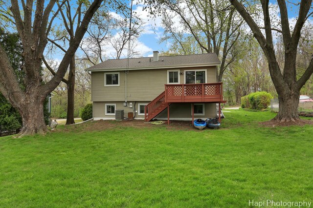 1113 Rolling Lane Rd, Johnsburg, IL 60051 - back of property with stairway, a wooden deck, a yard, and a chimney