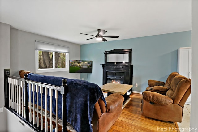 1113 Rolling Lane Rd, Johnsburg, IL 60051 - living room with a ceiling fan, a glass covered fireplace, and hardwood / wood-style flooring