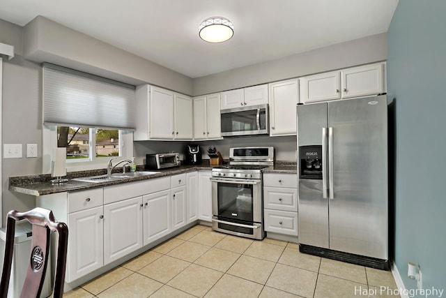 1113 Rolling Lane Rd, Johnsburg, IL 60051 - kitchen featuring appliances with stainless steel finishes, white cabinets, and light tile patterned floors