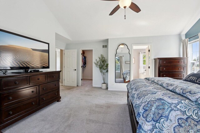 18485 W Springwood Dr, Grayslake, IL 60030 - bedroom with light carpet, lofted ceiling, a spacious closet, ceiling fan, and ensuite bath