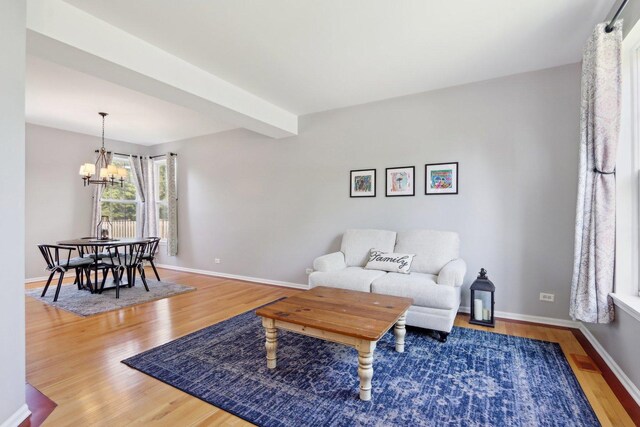 18485 W Springwood Dr, Grayslake, IL 60030 - living area featuring a chandelier and wood finished floors