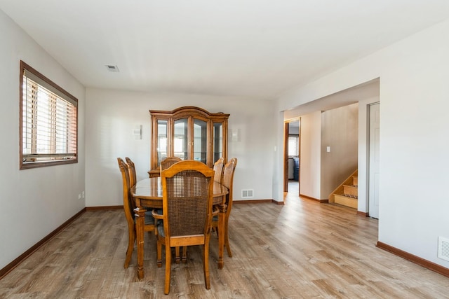 13707 W Carefree Dr, Homer Glen, IL 60491 - dining area with stairway and light wood-type flooring