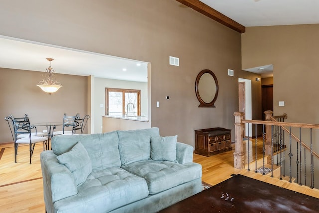 13707 W Carefree Dr, Homer Glen, IL 60491 - living room with light wood finished floors, beam ceiling, and high vaulted ceiling