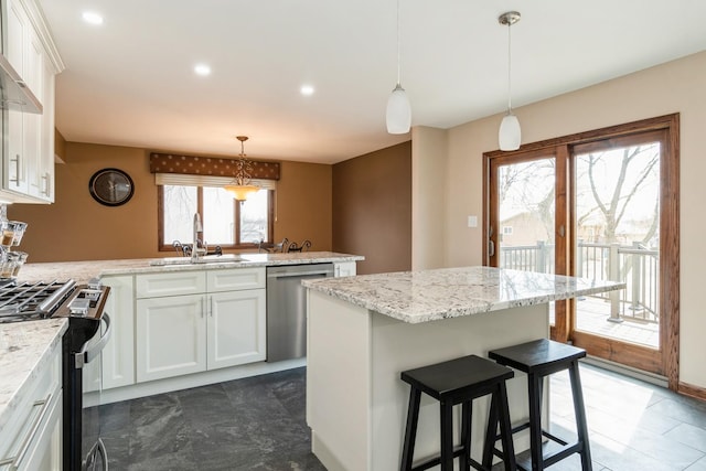 13707 W Carefree Dr, Homer Glen, IL 60491 - kitchen featuring stainless steel appliances, a peninsula, white cabinetry, wall chimney range hood, and recessed lighting